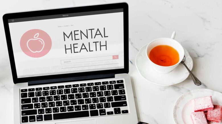 A person reviewing health insurance documents with a focus on mental health denial issues