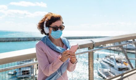 Cruise ship at sea with text overlay about medical evacuation and missed port travel insurance coverage