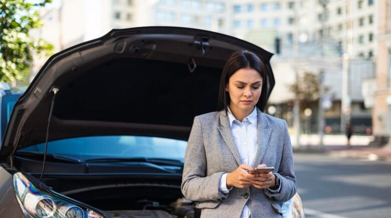 Person reviewing car insurance documents after bankruptcy filing