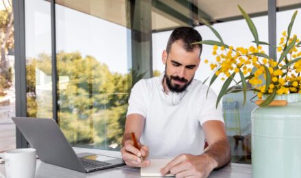 Freelancer reviewing insurance documents and building a complete coverage plan at home office