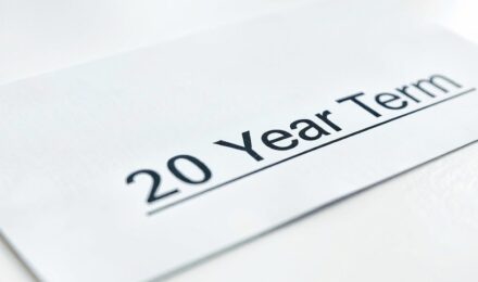 A 40-year-old homeowner reviewing life insurance options with a mortgage