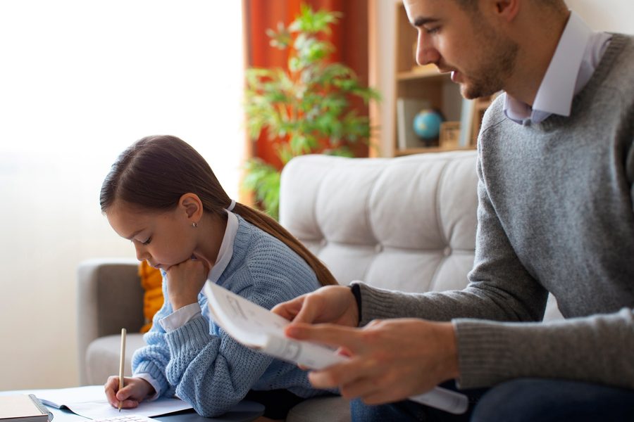 Dual-income couple reviewing term life policies together at kitchen table