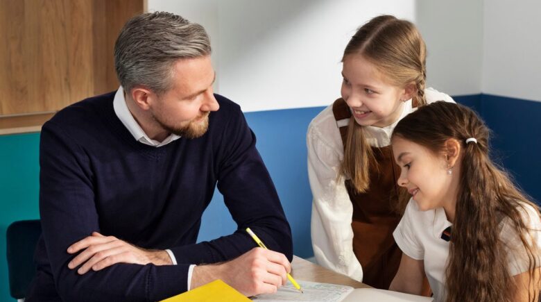 Teacher in classroom with young students, illustrating the family financial protection gap for educators