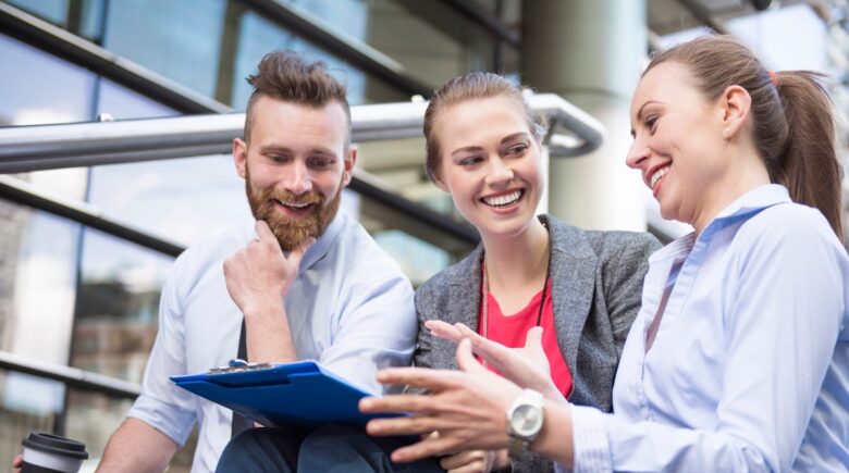 Young professional reviewing term life insurance policy options on laptop