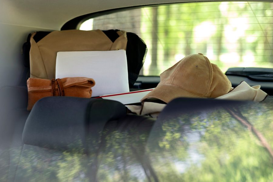 Image: A driver reviewing their auto insurance policy with a rideshare endorsement highlighted