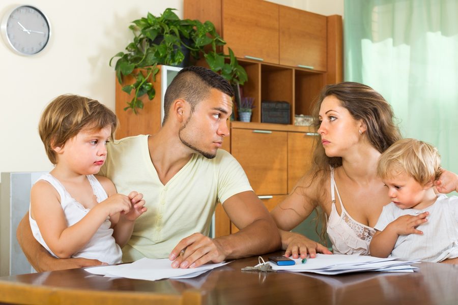 A checklist on a clipboard listing insurance policies with cancelation notes.