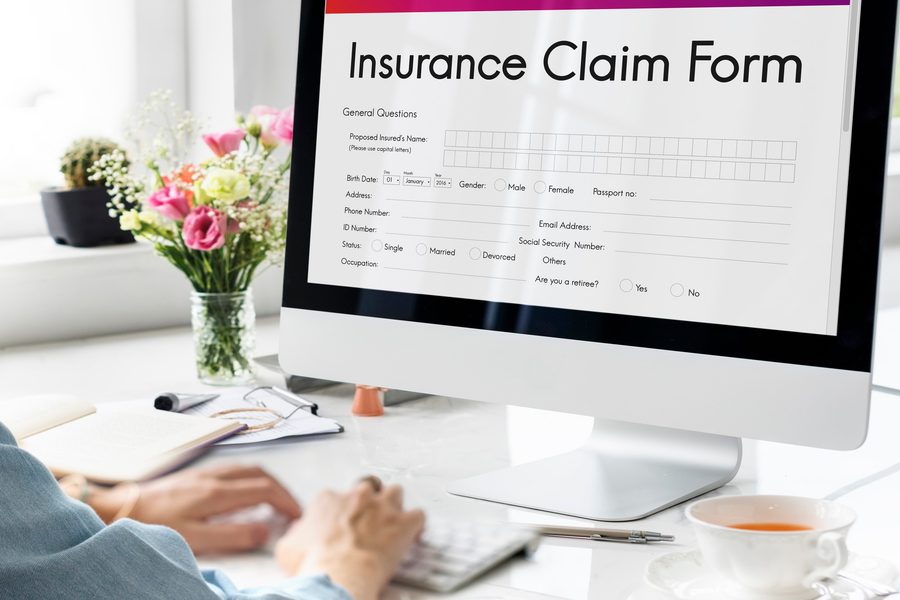 Independent insurance agent comparing multiple Texas carrier quotes on a tablet