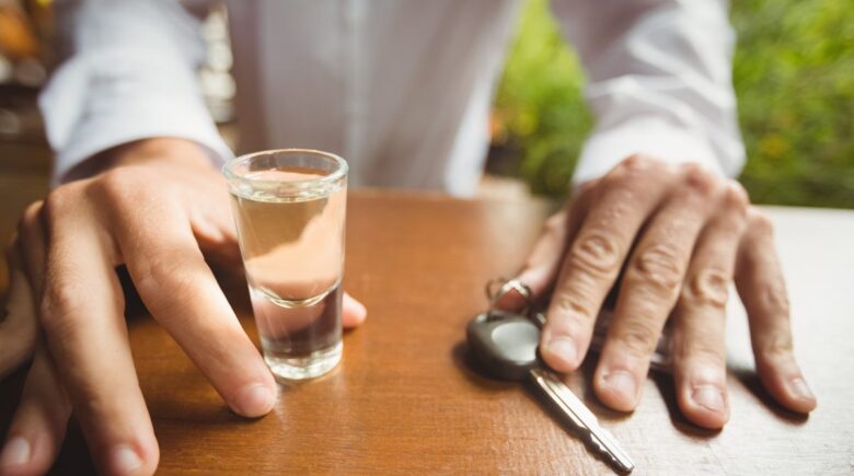Colorado driver reviewing auto insurance documents after DUI charge