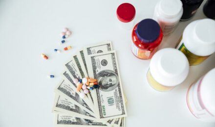 Person reviewing HSA contribution limits and prescription medication costs for 2026