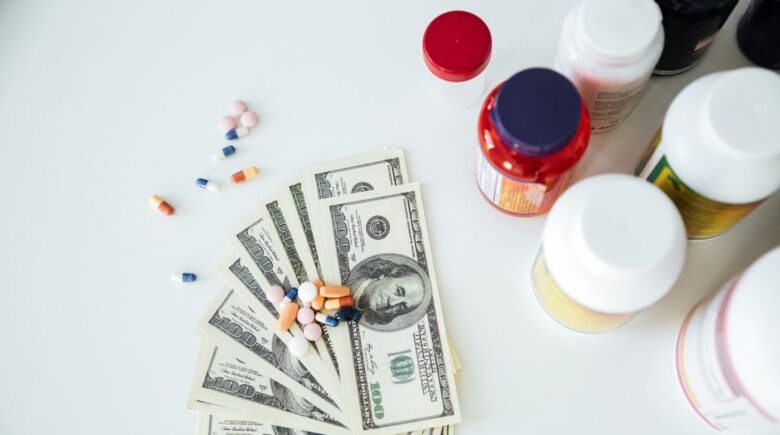 Person reviewing HSA contribution limits and prescription medication costs for 2026